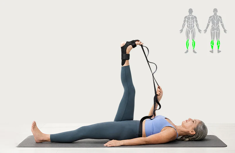 Lying leg stretch with one leg raised using a strap