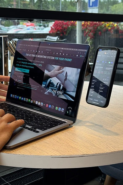 Phone mount beside a laptop