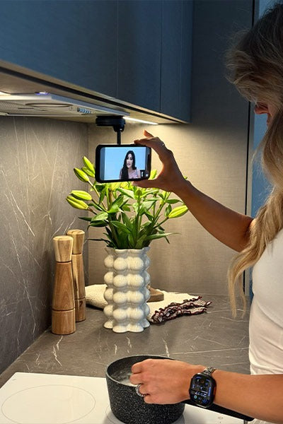 Versatile phone holder that can be attached anywhere